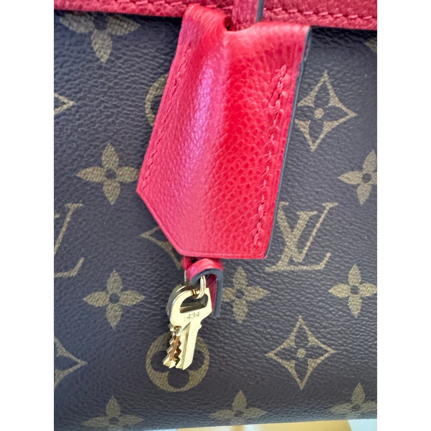Louis Vuitton Venus Monogram Handbag with Red Cerise Leather Trim