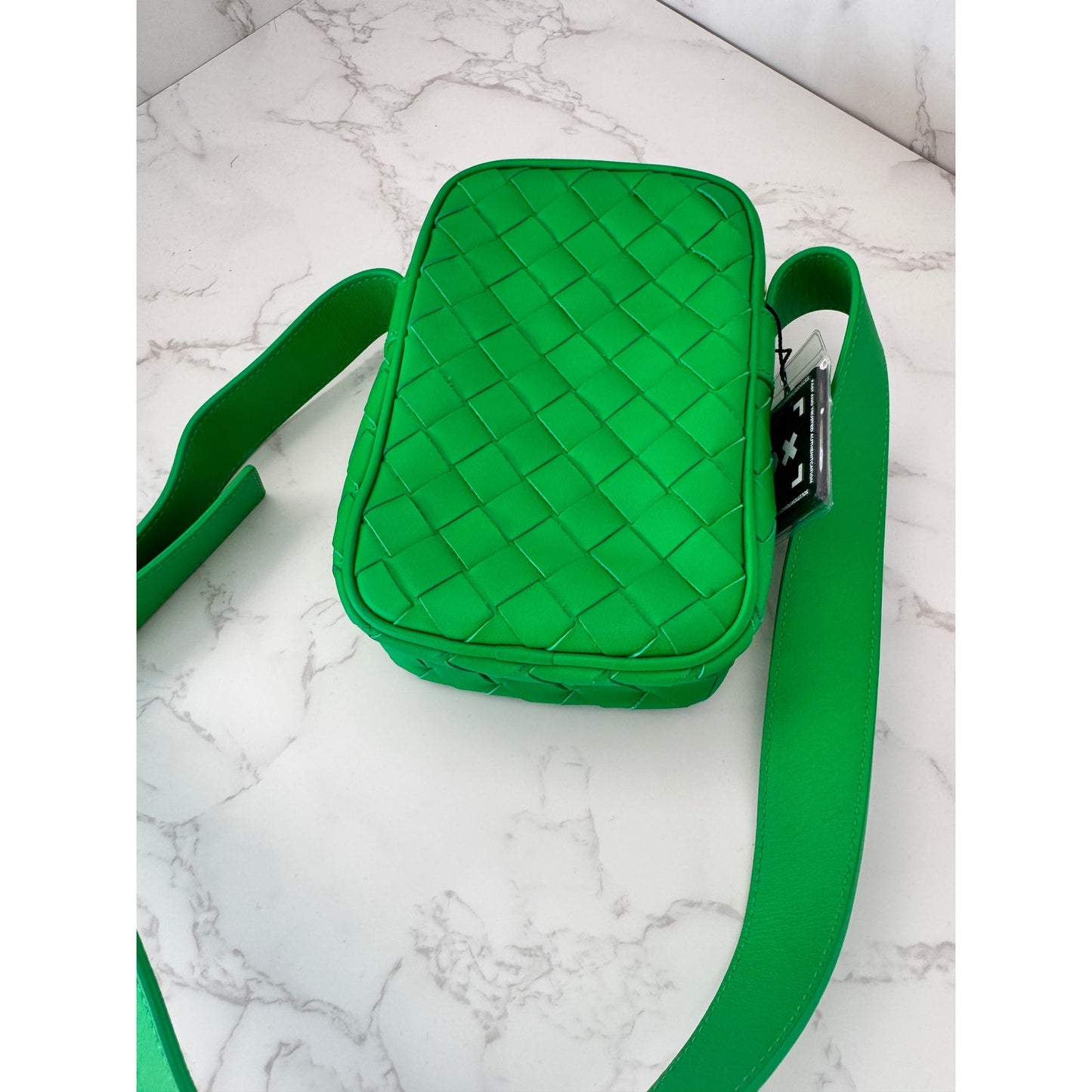 Bottega Veneta Intrecciato woven leather phone pouch in parakeet green!